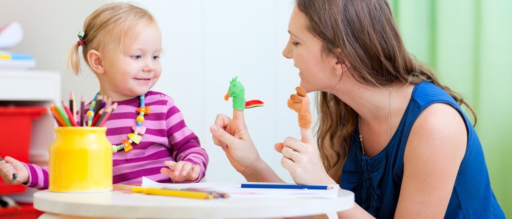 A therapist working with a child
